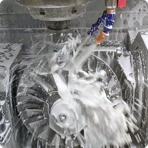 High-speed 5-axis CNC machine milling a metal block into a precision aerospace component