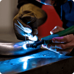 Comparison of industrial welding processes including MIG, TIG, and Stick welding for diverse metal alloys