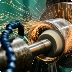 Detailed view of the grinding process highlighting the need for coolant management and high-precision setup