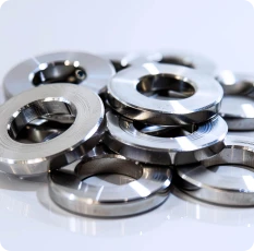 Small, complex metal components manufactured via high-precision Metal Injection Molding (MIM).