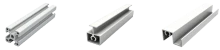 Professional engineer reviewing custom metal extrusion profiles for a project quote.