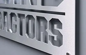 A close-up of a high-quality custom metal sign with the word 'TRACTORS' precisely cut out, showcasing a clean, brushed aluminum finish ideal for business and architectural signage.