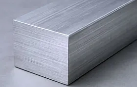 A close-up of a high-quality, square extruded aluminum bar with a brushed finish, representing the raw stock material used for CNC machining projects.